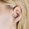 Tragus- oder Helixpiercing mit einem Stern Piercings - Deutschland