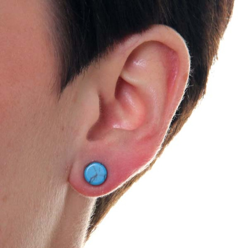Türkiser Plug aus einem Stein Piercings - Deutschland