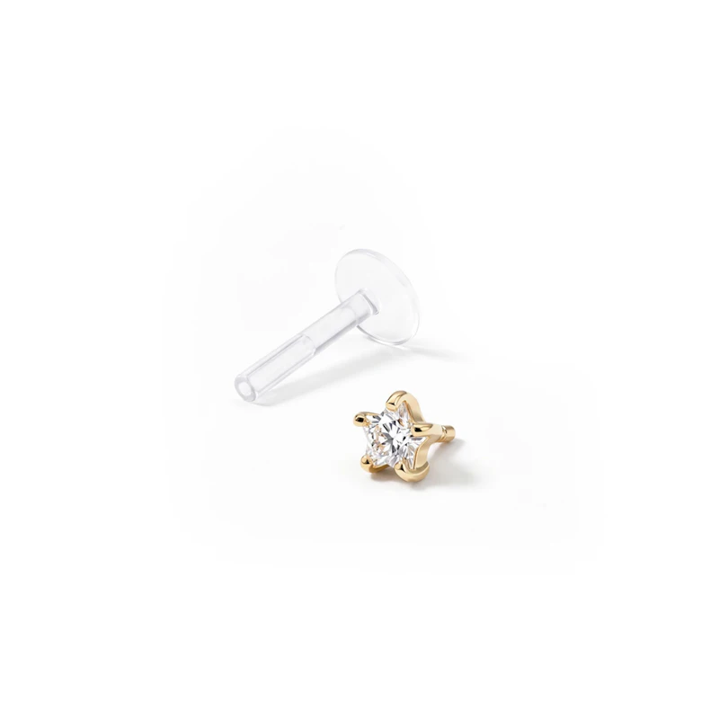 Labret aus 14 Karat Gold mit einem sternförmigen Stein und PTFE Stab